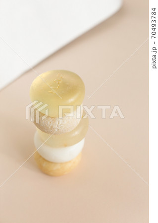 Five bars of natural handmade translucent soap in light background. Five bars of natural handmade translucent soap in light background. 70493784