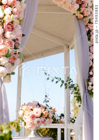 Wonderful wedding arch decorated by pink and white flowers. Wonderful wedding arch decorated by pink and white flowers. 70493883