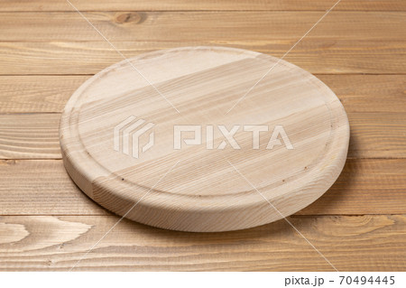 round wooden cutting board on wooden boards round wooden cutting board on wooden boards 70494445
