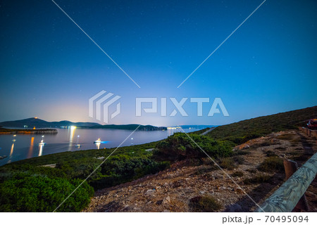 Starry night over Porto Conte bay 70495094