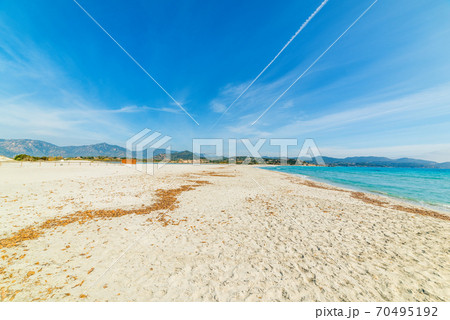 White sand in Porto Giunco shore 70495192