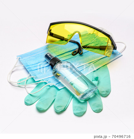 Safety equipment to fight to Coronavirus COVID-19 virus outbreak - Safety mask, hand sanitizer, latex gloves and protective glasses or goggles Safety equipment to fight to Coronavirus COVID-19 virus outbreak - Safety mask, hand sanitizer, latex gloves and protective glasses or goggles 70496716
