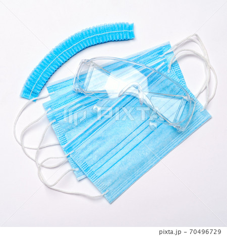 Safety equipment to fight to Coronavirus COVID-19 virus outbreak - Safety mask and protective glasses or goggles 70496729