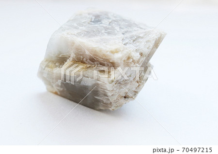 Textured surface moon stone isolated on white background Textured surface moon stone isolated on white background 70497215