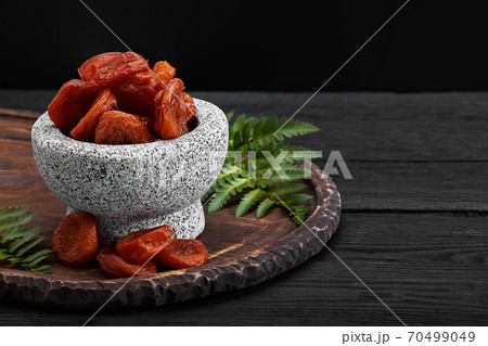 dried apricots on a dark wood background. tinting. selective focus 70499049