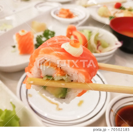 Sushi roll with salmon, shrimps and avocado.. 70502185
