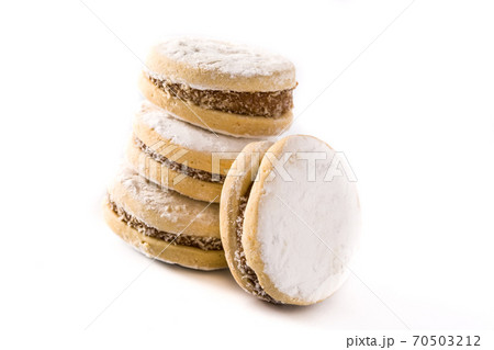 Traditional Argentinian alfajores with dulce de leche and sugar isolated on white background 70503212