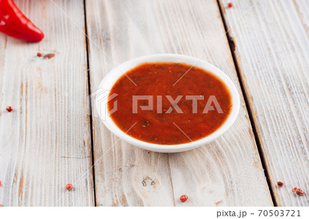 Side view on red spiced sauce for meat Side view on red spiced sauce for meat 70503721