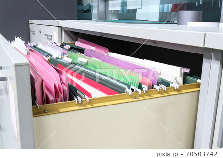 Files document of hanging file folders in a drawer in a whole pile of full papers, at work office, Business Concept Office document storage Files document of hanging file folders in a drawer in a whole pile of full papers, at work office, Business Concept Office document storage 70503742