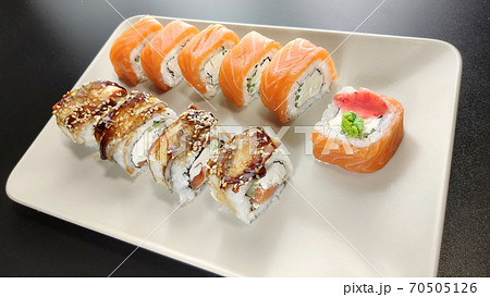 California and philadelphia roll with red chopsticks on a plate 70505126