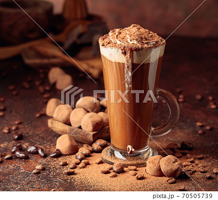 Truffles and glass of hot chocolate with whipped cream. 70505739