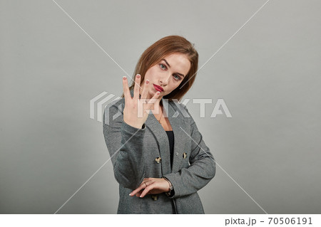 Showing four 4 fingers hand gesture, show number three with hands, pointing up Showing four 4 fingers hand gesture, show number three with hands, pointing up 70506191