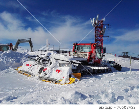 Snow-covered snow removal equipment on the slope of a winter ski resort Snow-covered snow removal equipment on the slope of a winter ski resort 70508452
