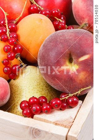 Fresh ripe fruits in wooden box. Food containing healthy minerals and vitamins 70514030