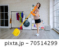 a woman clean home 70514299
