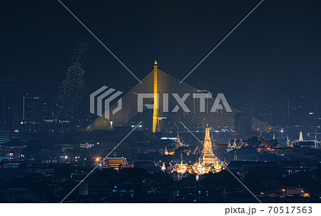 Drone show about The King rama 9, Bhumibol Adulyadej in memorial, at Rama 8 Bridge and Temple of Dawn or Wat Arun, Urban town city, Bangkok skyline. downtown area, Thailand at night. Drone show about The King rama 9, Bhumibol Adulyadej in memorial, at Rama 8 Bridge and Temple of Dawn or Wat Arun, Urban town city, Bangkok skyline. downtown area, Thailand at night. 70517563
