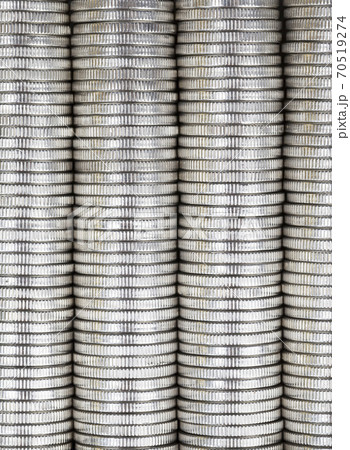 coins of silver color stacked together coins of silver color stacked together 70519274