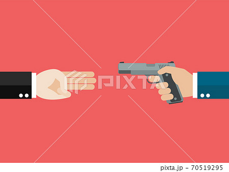 Hand showing three fingers salute againts hand holding handguns 70519295
