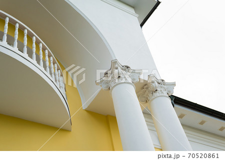 White building with columns in the classical style 70520861