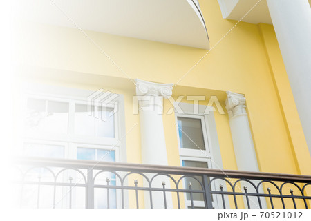 White building with columns in the classical style 70521012