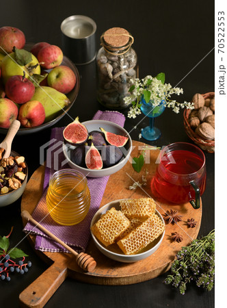 Honey, Honeycomb, Tea, Dried Fruits and Figs Honey, Honeycomb, Tea, Dried Fruits and Figs 70522553