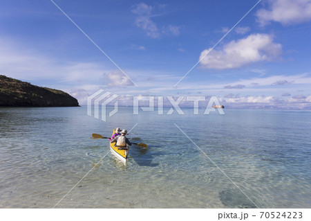 Couple in a kayak, paddling on the Sea of Cortes, also known as the Gulf of California, Mexico. Couple in a kayak, paddling on the Sea of Cortes, also known as the Gulf of California, Mexico. 70524223