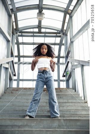 young cute teenage african girl in industrial zone happy smiling having fun, big city lifestyle fashion people young cute teenage african girl in industrial zone happy smiling having fun, big city lifestyle fashion people 70525658