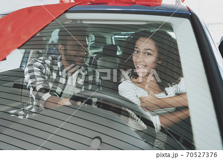 African american family at car dealership. African american family at car dealership. 70527376