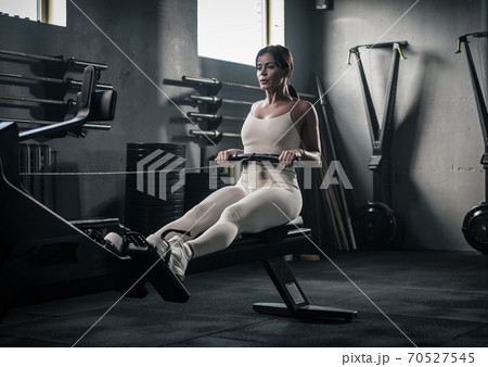 Beautiful Woman Has Arms Workout On Rowing Machine . Beautiful Woman Has Arms Workout On Rowing Machine . 70527545