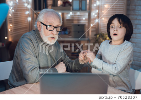 Grandfather and grandson holding hands. Grandfather and grandson holding hands. 70528307