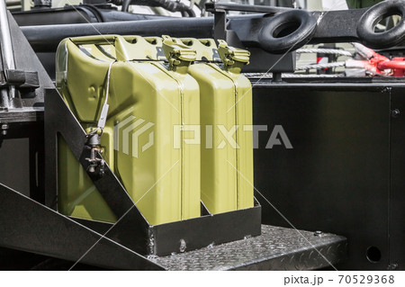 fuel can is attached to the Board of a truck 70529368