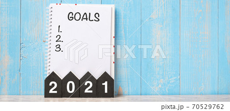 2021 Happy New Year with GOAL word and wooden number. time for a New Start, Resolution, Plan, Action and Mission Concept 2021 Happy New Year with GOAL word and wooden number. time for a New Start, Resolution, Plan, Action and Mission Concept 70529762