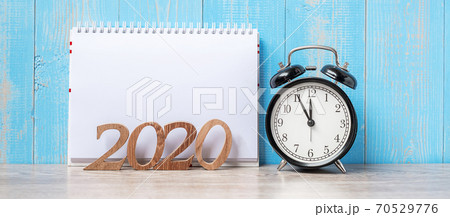 2020 Year with blank notebook, black retro alarm clock and wooden number. New Start, Resolution, Goals, Plan, Action and Mission Concept 2020 Year with blank notebook, black retro alarm clock and wooden number. New Start, Resolution, Goals, Plan, Action and Mission Concept 70529776
