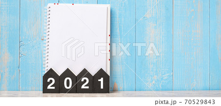 2021 Happy New Year with blank notebook and wooden number. time for a New Start, Resolution, goal, Plan, Action and Mission Concept 2021 Happy New Year with blank notebook and wooden number. time for a New Start, Resolution, goal, Plan, Action and Mission Concept 70529843