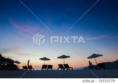 umbrella on beach under vivid colorful of sky 70533779