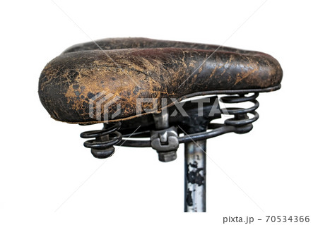 The leather saddle on old motorcycle, isolated on white background. The leather saddle on old motorcycle, isolated on white background. 70534366