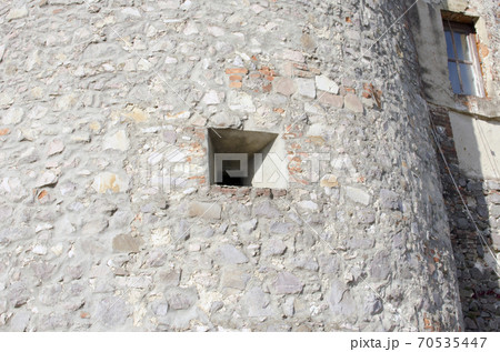 Embrasure, loophole in the wall of an old mountain fortress. 70535447