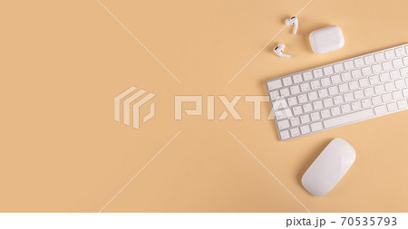 A neutral colored workplace with modern personal equipment and gadgets 70535793