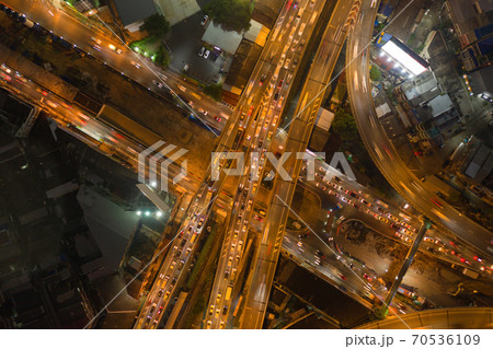 Aerial view of cars driving on highway junctions. Bridge street roads in connection network of architecture concept. Top view. Urban city, Bangkok at night, Thailand. 70536109