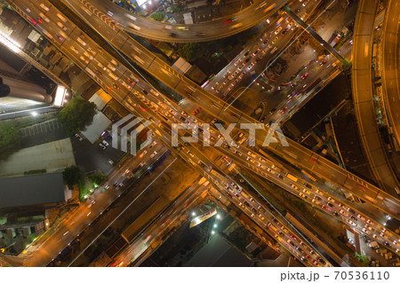 Aerial view of cars driving on highway junctions. Bridge street roads in connection network of architecture concept. Top view. Urban city, Bangkok at night, Thailand. 70536110