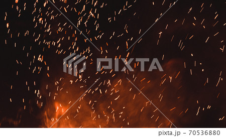 close up of sparks from fire, sparks on black background, extravaganza of fire, magic with sparks. close up of sparks from fire, sparks on black background, extravaganza of fire, magic with sparks. 70536880