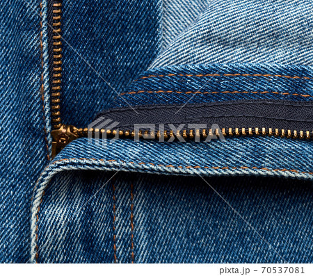 iron yellow zipper on the fly on blue jeans iron yellow zipper on the fly on blue jeans 70537081