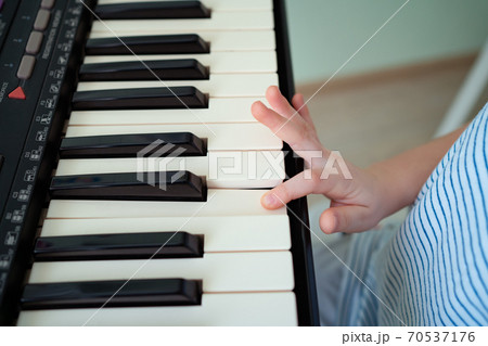 hands black white piano keys synth. close-up. 70537176