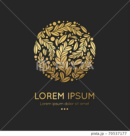 Golden emblem with leaves in a circle shape.  70537177