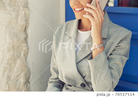 Woman is talking on mobile phone. 70537514