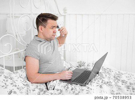 freelancer is sick, measures temperature home bed freelancer is sick, measures temperature home bed 70538953