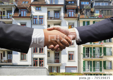 businessmen shaking hands on business concept background businessmen shaking hands on business concept background 70539835