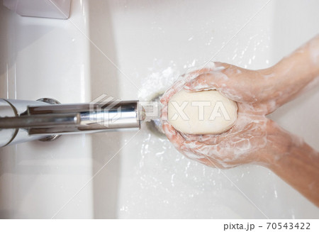 thorough washing of female hands soap and water thorough washing of female hands soap and water 70543422