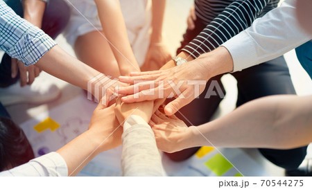 Background of diversity human bare hands join together in the middle under with warm natural sun light, Concept power of social network or volunteer's to be unity help and support the network society. 70544275