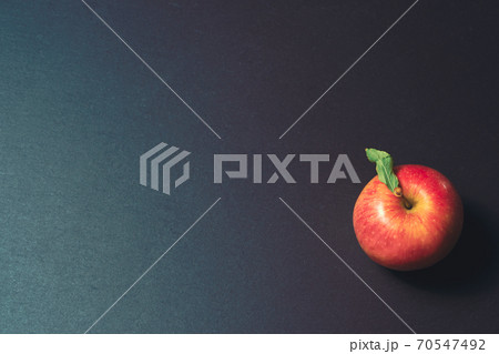 one apple on a stone kitchen table close up one apple on a stone kitchen table close up 70547492